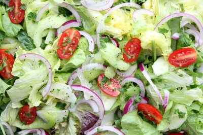Fresh garden salad with red onion and cherry tomatoes